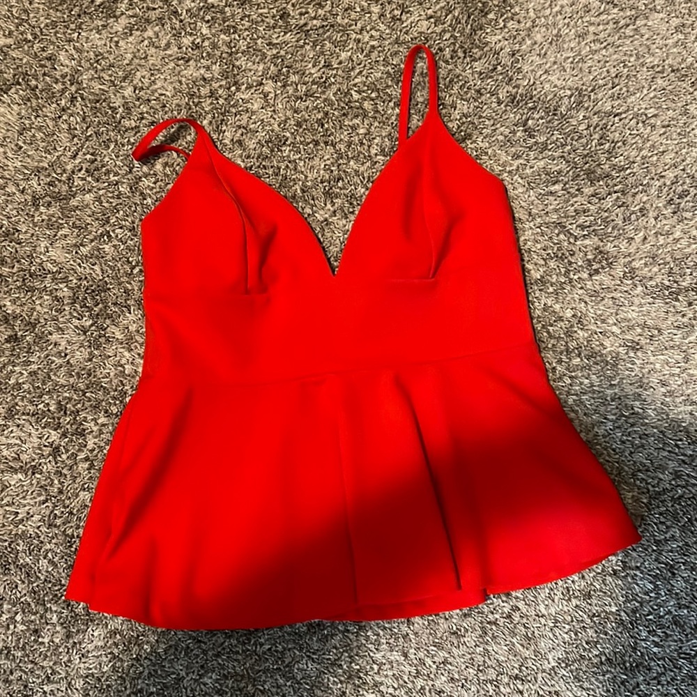 Red shirt, lower cut on the top